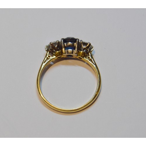 153 - Diamond and sapphire three-stone ring, set with two brilliants, approximately .3ct each, total diamo... 