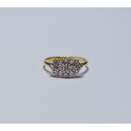 154 - Diamond oval cluster ring set with baguettes and brilliants, 18ct gold, size R, 3.4g gross.