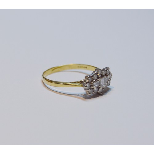 154 - Diamond oval cluster ring set with baguettes and brilliants, 18ct gold, size R, 3.4g gross.