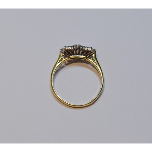 154 - Diamond oval cluster ring set with baguettes and brilliants, 18ct gold, size R, 3.4g gross.