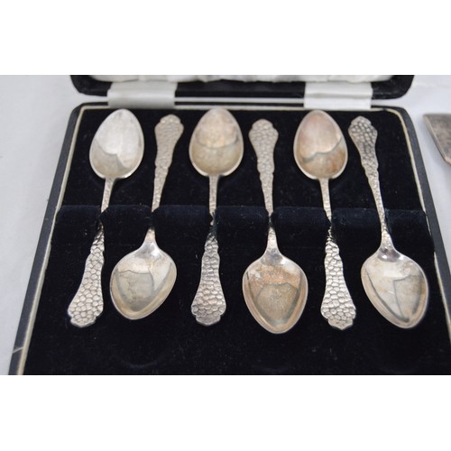 67 - Set of six silver coffee spoons of unusual style, cased, and four others pieces of silver flatware, ... 