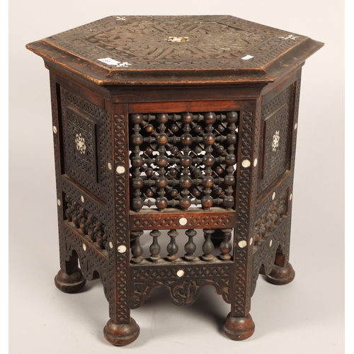 555 - Middle Eastern style hexagon shaped table with mother of pearl inlay, approx 50cm h x 46cm across