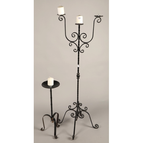 575 - Two wrought iron candle sticks