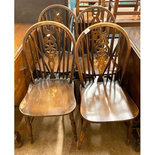 672 - Four oak dining chairs