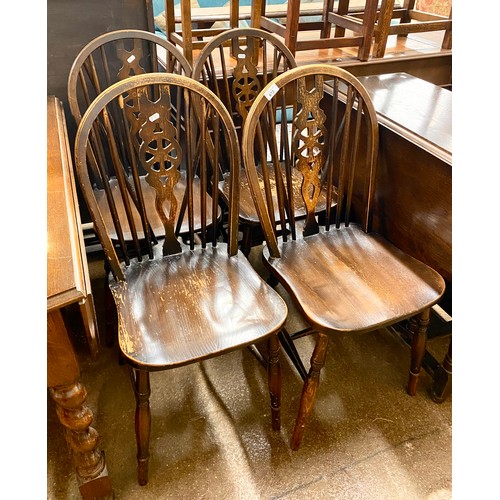 672 - Four oak dining chairs