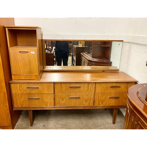 661 - Four piece teak bedroom suite comprising of two double wardrobes,dressing chest & bedside cabine... 