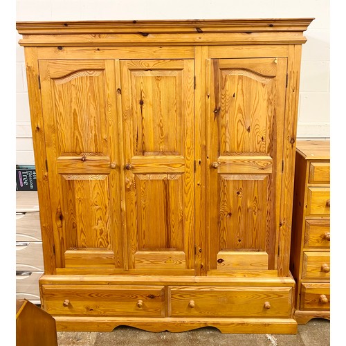 687 - Large pine wardrobe with two over three pine chest of drawers