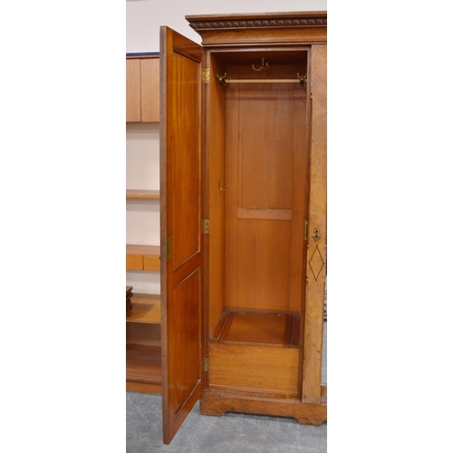 435 - Late Victorian Pugin-style pitch pine wardrobe, the central mirrored pivot door flanked by panelled ... 