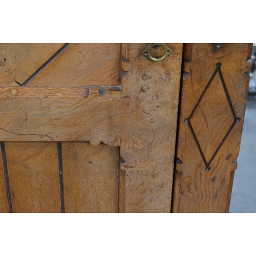 435 - Late Victorian Pugin-style pitch pine wardrobe, the central mirrored pivot door flanked by panelled ... 