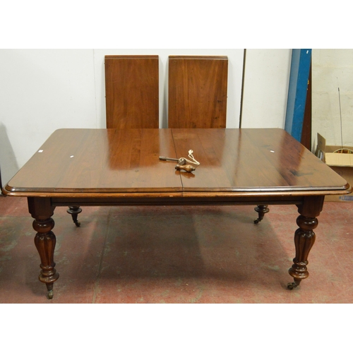 436 - Victorian mahogany dining table with canted corners to the top, two additional leaves, on turned and... 