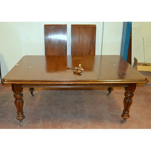 436 - Victorian mahogany dining table with canted corners to the top, two additional leaves, on turned and... 