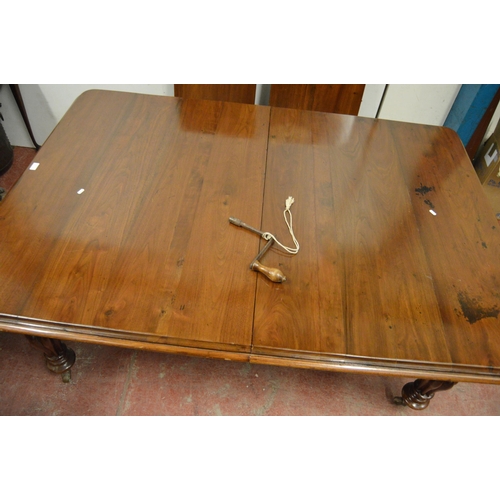 436 - Victorian mahogany dining table with canted corners to the top, two additional leaves, on turned and... 