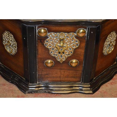 437 - Dutch Colonial teak and ebony chest, c. 19th century, the hinged top with brass studs, serpentine fr... 