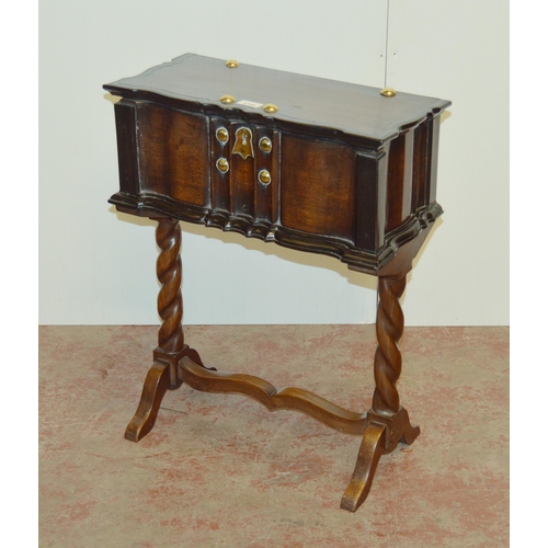 438 - Dutch Colonial teak and ebony work table, the hinged top with brass studs and to the frieze, on barl... 