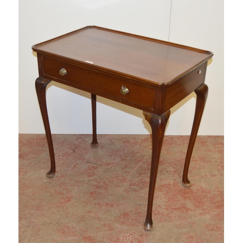 445 - 19th century mahogany silver table, the tray top with canted corners above single drawer below, on c... 