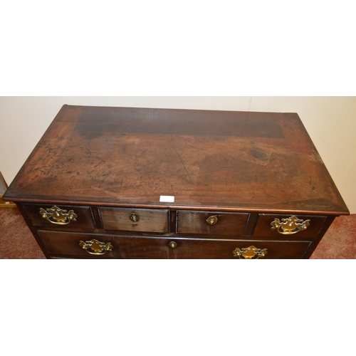 446 - 18th century North European-style walnut chest of four short and three long graduated drawers, iron ... 