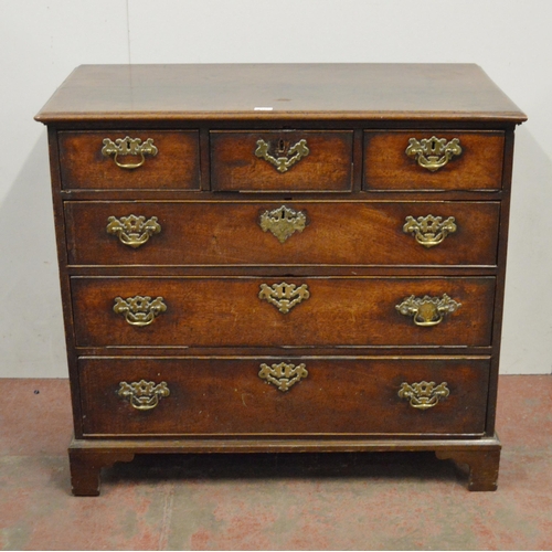 448 - 18th century oak chest of three short and three long drawers, on bracket feet, with later brass hand... 