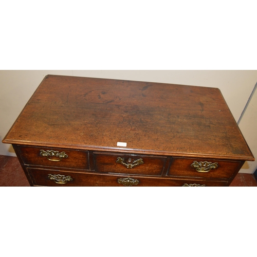 448 - 18th century oak chest of three short and three long drawers, on bracket feet, with later brass hand... 