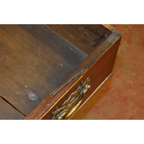 448 - 18th century oak chest of three short and three long drawers, on bracket feet, with later brass hand... 