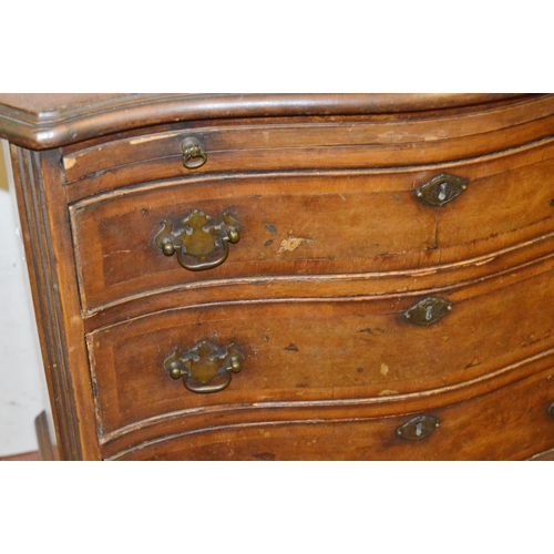 449 - Walnut serpentine chest of small proportions, with a brushing slide above four graduated drawers, on... 