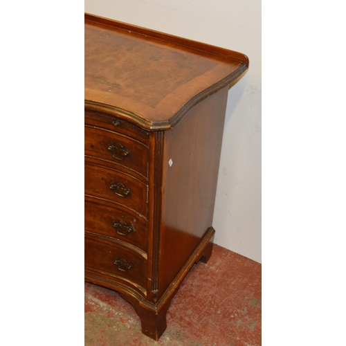 449 - Walnut serpentine chest of small proportions, with a brushing slide above four graduated drawers, on... 