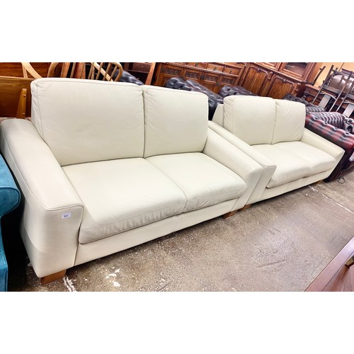 633 - Pair matching two-piece cream leather settees