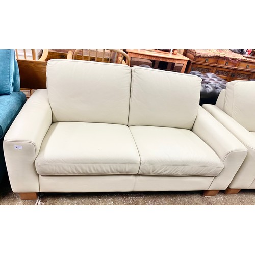 633 - Pair matching two-piece cream leather settees