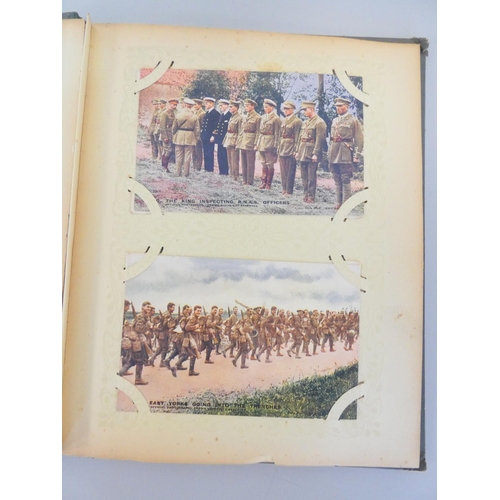 330 - Postcard album containing 52 First World War scenes to include the famous A Present for the Kaiser 