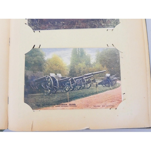 330 - Postcard album containing 52 First World War scenes to include the famous A Present for the Kaiser 