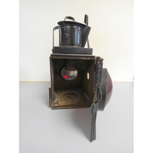 344 - 1930s paraffin BR warning light in black japanned finish with red convex lens. 