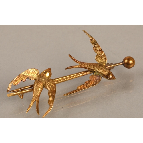 208 - 9ct gold bar brooch with swallow design (3.7g), and another yellow metal brooch set with pink gems a... 