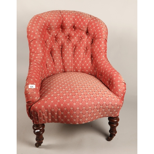 628 - Button back armchair in red floral upholstery