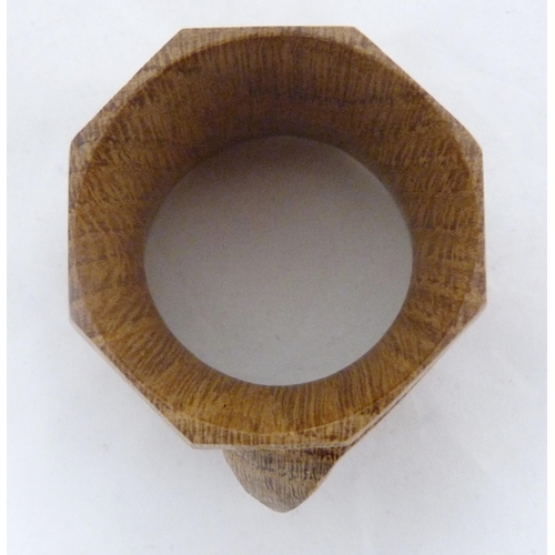 218 - Workshop of Robert 'Mouseman' Thompson of KilburnThree oak octagonal napkin rings, all bearing trade... 