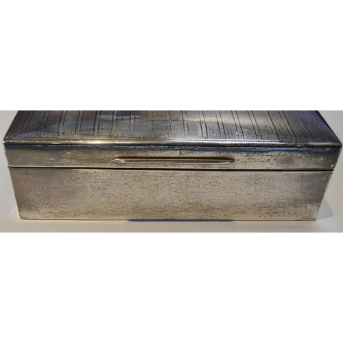 36 - Silver cigarette casket with engraved engine turned hinged top, the interior with cedar-lined compar... 