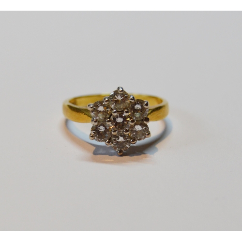 123 - Diamond seven-stone cluster ring with brilliants, each approximately .1ct, total diamond content app... 