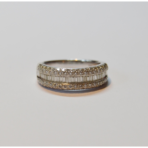 131 - Diamond half eternity ring with a band of baguettes flanked by bands of small brilliants, in 18ct wh... 