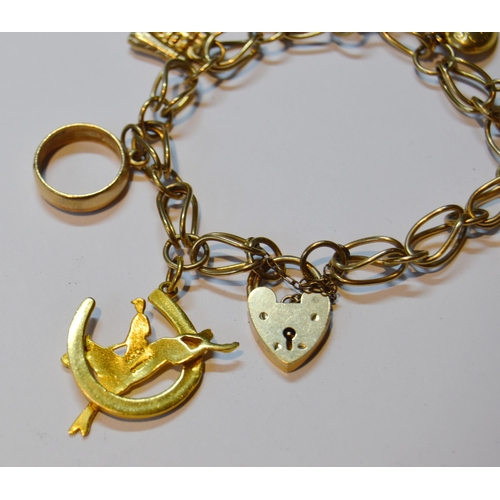 141 - 9ct gold padlock bracelet with dependant charms, marked '375' to most, 22g gross.