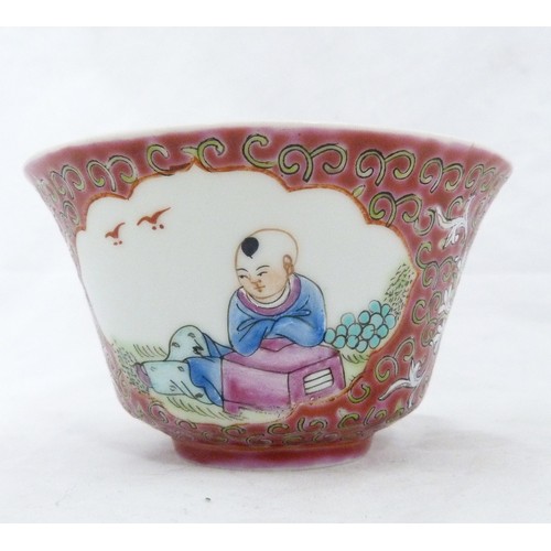 299 - Pair of Chinese red Mun Shou famille rose bowls, (probably Republic period) in the 'Longevity' patte... 