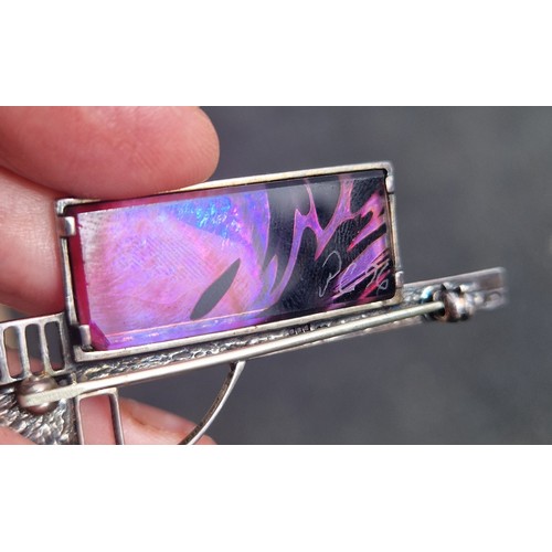 83 - Arts and crafts / Glasgow style silver brooch set with iridescent glass panel, signed 'PG 96' illegi... 