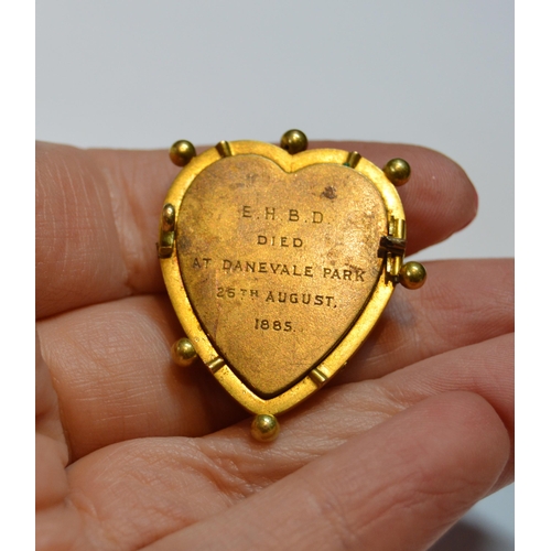 115 - Set of three Victorian gold mourning brooches of heart shape with tinted photographs under crystal, ... 