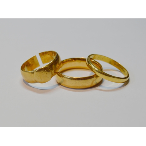 158 - Two 18ct gold band rings, 8.7g gross, and another cut ring, unmarked, 5.6g.  (3)