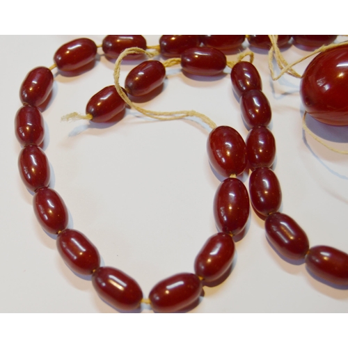 162 - Collection of Bakelite cherry amber beads, loose, probably from two strands, largest approximately 2... 