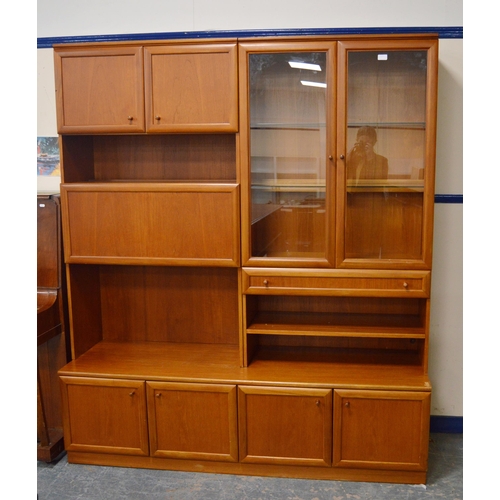 454 - McIntosh of KirkcaldyTeak display unit with two glazed doors enclosing glass shelves above a drawer ... 