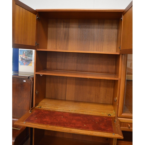 454 - McIntosh of KirkcaldyTeak display unit with two glazed doors enclosing glass shelves above a drawer ... 