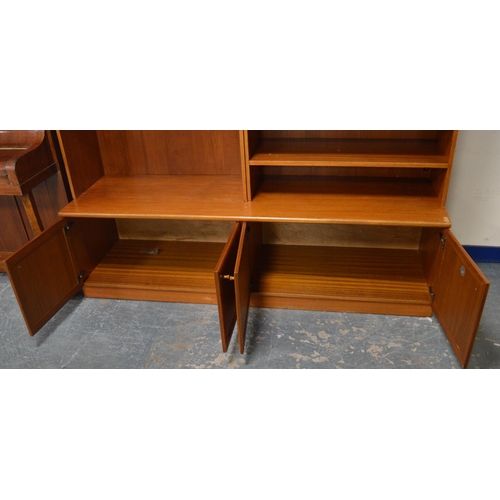 454 - McIntosh of KirkcaldyTeak display unit with two glazed doors enclosing glass shelves above a drawer ... 