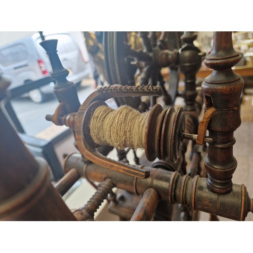 526 - Mahogany spinning wheel, approx 87cm to top of wheel