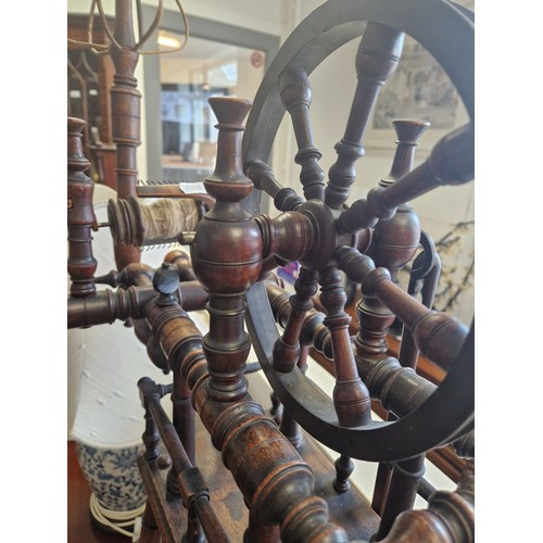 526 - Mahogany spinning wheel, approx 87cm to top of wheel