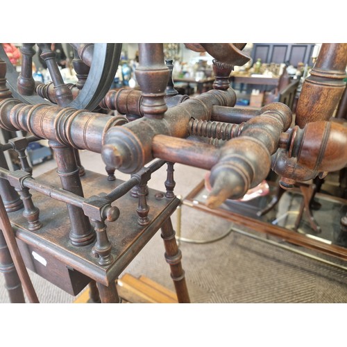 526 - Mahogany spinning wheel, approx 87cm to top of wheel