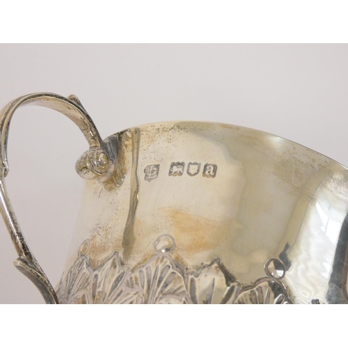 10 - Silver embossed bowl 1861, a similar mug 1900 and a porringer 1896. 496g (3) 