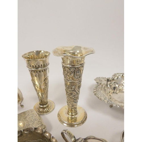 13 - Two silver embossed vases, a cigarette case, various condiments and other items. 768g